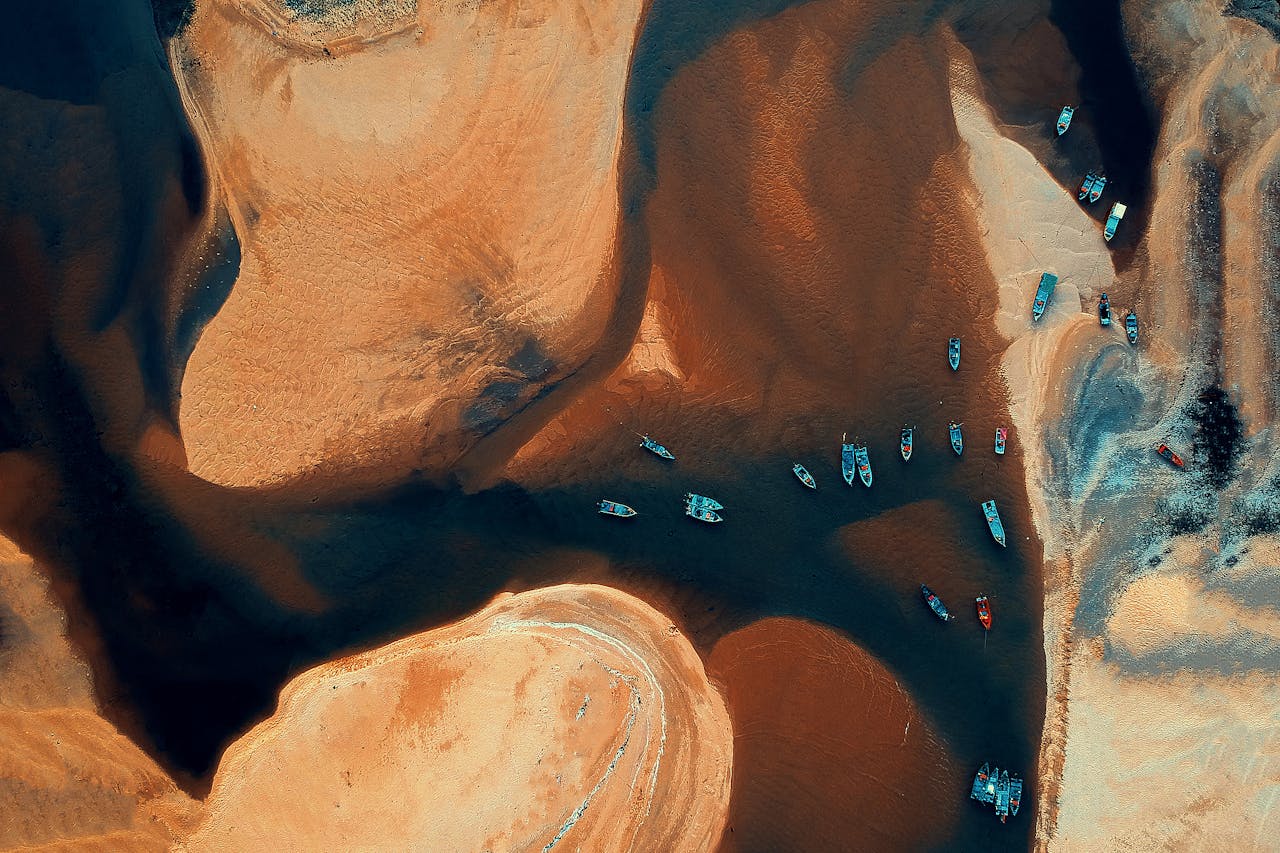 Stunning aerial view of vibrant boats on Kemasik river, Malaysia. Ideal for travel visuals.